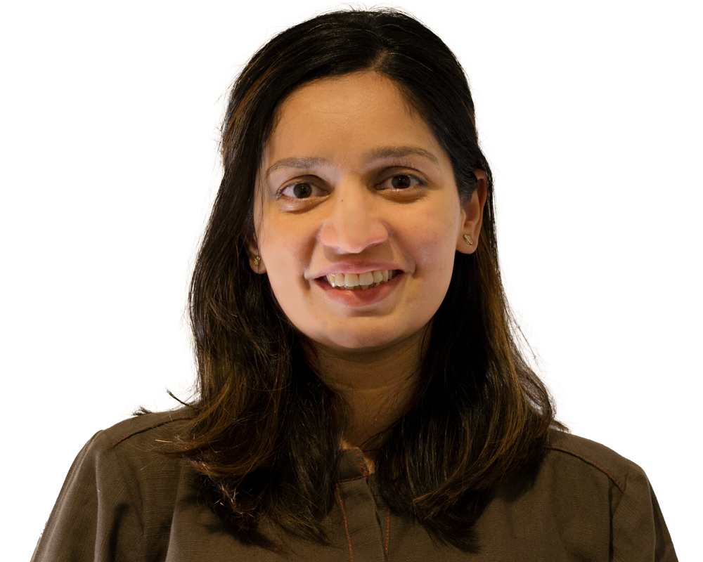 Aisha Saad, a registered physiotherapist at Moore Than Physio clinic in Glen Eden, smiling in clinic